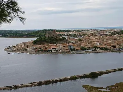 an island in the middle of a body of water at Le zéphyr in Gruissan
