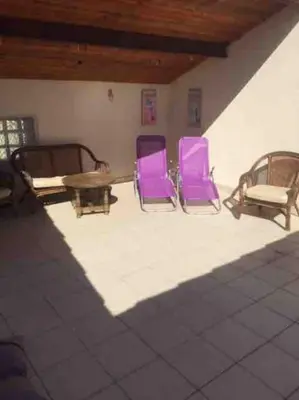 three purple chairs and a table in a room at Maison Ventenac village house in Ventenac en Minervois