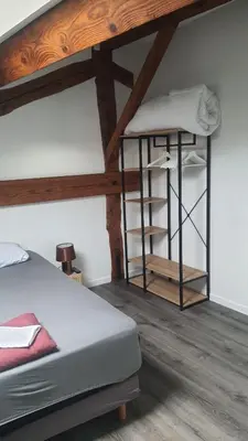 a bedroom with a bunk bed and a wooden ceiling at SUPERBE T3 AU COEUR DU CENTRE VILLE in Narbonne
