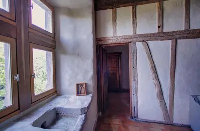 a bathroom with a sink in a room with windows at Château de Mézerville in Mézerville