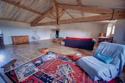 a living room with a couch and a table at Château de Mézerville in Mézerville
