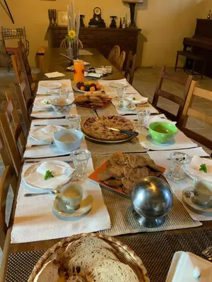 a long table with plates of food on it at Château de Mézerville in Mézerville