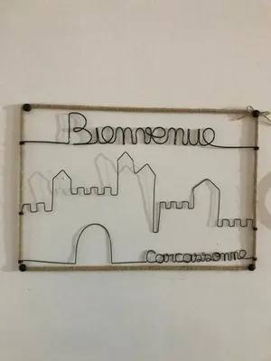 a sign with the words bournemouth on a wall at Le grenier de Manée in Villemoustaussou