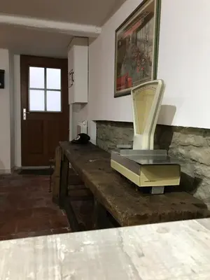 a room with a table with a chair on it at Le grenier de Manée in Villemoustaussou