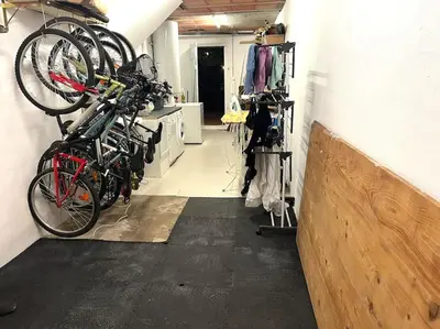 a room with several bikes hanging on a wall at La Maison de Mama C: Charming french village home in Sainte-Colombe-sur-lʼHers