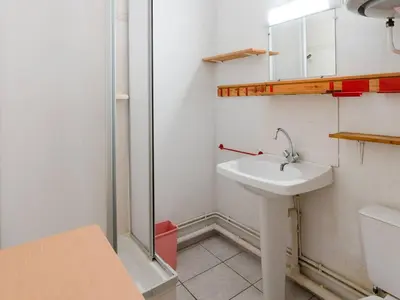 a bathroom with a sink and a shower at Appartement à Gruissan avec Piscine - 4 Pers. - FR-1-409A-8 in Narbonne