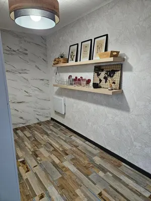 a hallway with wooden flooring and shelves on the wall at Marina 4 ou 8 ou 9 in Narbonne