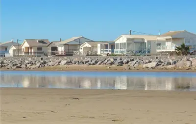 a group of houses on the shore of a beach at 1 Bedroom Gorgeous Home In Capestang in Capestang