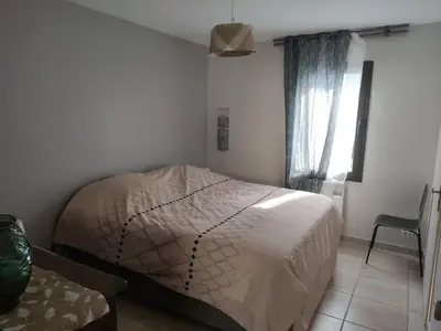 a bedroom with a bed in a room at Charmant T2 moderne au calme avec jardin vue sur Canigou in Molitg les Bains