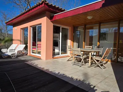 a patio with a table and chairs on a house at Evasion en pays Cathare in Quillan