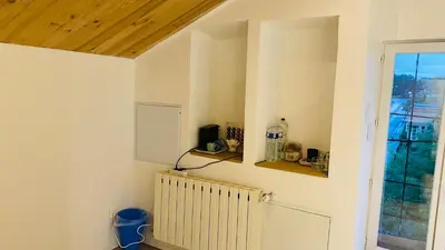 a room with a radiator and a window at Studio Cros climatisé in Castres