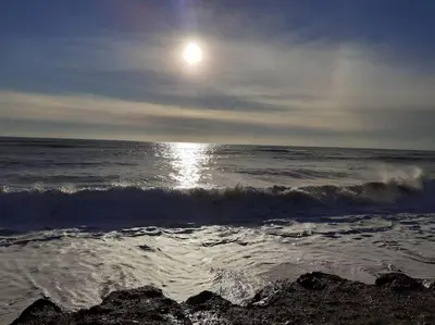 a beach with the sun rising over the ocean at Appart 2/4 pers proche centre avec Balcon, Parking in Narbonne