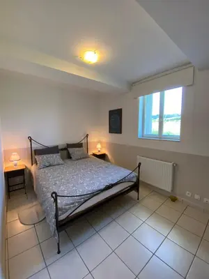 a bedroom with a bed and a window at Gîte - Le Relais d'Affiac in Peyriac-Minervois