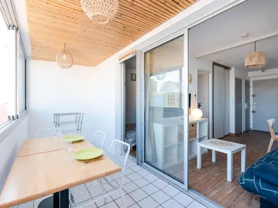 a kitchen and dining room with a table and chairs at Appartement Gruissan - Parking Privé, Animaux Acceptés - FR-1-409A-16 in Gruissan