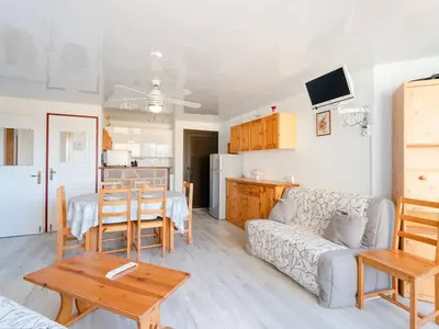 a living room with a couch and a table at Appartement lumineux à Gruissan, 2 chambres, proche plage, parking sécurisé, mini-box WIFI, non-fumeur - FR-1-409A-15 in Gruissan