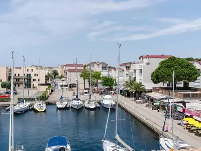 a group of boats docked in a marina at Duplex lumineux à Gruissan avec parking, proche plage et port - FR-1-409A-11 in Gruissan