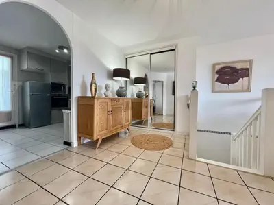 a large room with a kitchen and a living room at Duplex 70m2 - Vue Cité Mediévale - Parking gratuit in Carcassonne