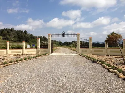 a gate to a driveway with a road at Le Havre Guest room in the heart of the vineyard no2307 in Badens