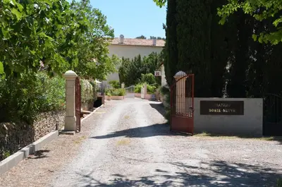 a driveway with a red gate in a house at Le Havre Guest room in the heart of the vineyard no2307 in Badens