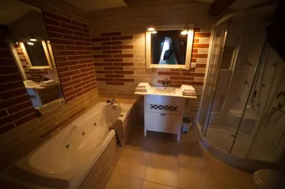 a bathroom with a tub and a sink and a shower at Londres guest room in the heart of the vineyard no123 in Badens