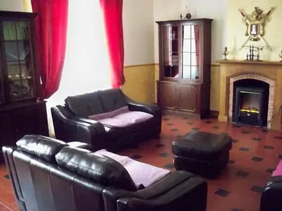 a living room with leather furniture and a fireplace at Wellington Guest Room in the heart of the vineyard no1205 in Badens
