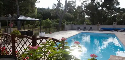a swimming pool in a yard with a fence at Wellington Guest Room in the heart of the vineyard no1205 in Badens