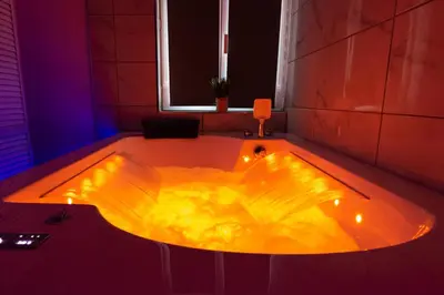 a jacuzzi tub with lights in a room at les Bulles Occitanes - tout à pied in Carcassonne