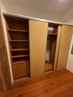an empty closet with wooden shelves in a room at Lauraguel Gîte in Mourvilles-Hautes