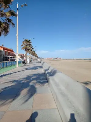 a shadow of a person taking a picture of the beach at Agréable Studio en bord de mer in Port-la-Nouvelle