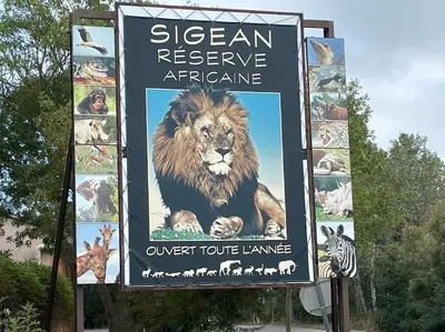a sign with a lion and other animals on it at NARBONNE : SUPER APPARTEMENT DE QUALITÉ in Narbonne