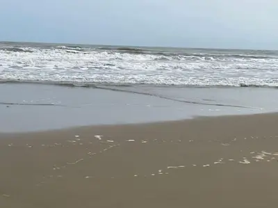 a person walking on the beach near the ocean at NARBONNE : SUPER APPARTEMENT DE QUALITÉ in Narbonne