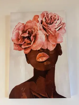 a painting of a woman with a flower on her head at LAURAGUEL CHAMBRES D'HÔTES in Mourvilles-Hautes