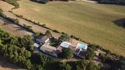 an aerial view of a house in a field at LAURAGUEL CHAMBRES D'HÔTES in Mourvilles-Hautes