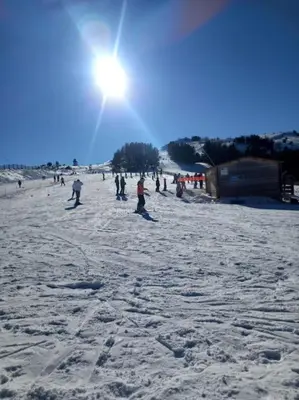 a group of people standing on a snow covered beach at Gîte l'Enclos Ô rendez-vous Roquefeuil-Pays de sault- avec jardin in Roquefeuil