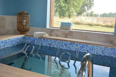 a bathroom with a sink with tongs and a window at Bastide des Tourelles pour 20 pers. Piscine & Spa in Marzens
