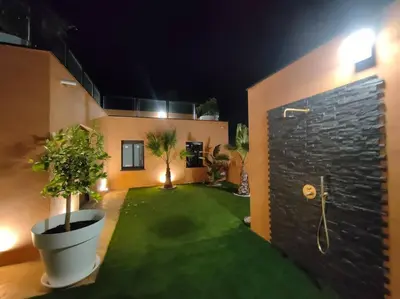 a room with a yard with a green lawn at La Villa Nina in Mirepeisset