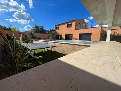 a view from the balcony of a house with a table at La Villa Nina in Mirepeisset