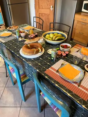 a table with a table cloth with food on it at Chambres d'hôtes : Les maisons de Gaïa in Tuchan