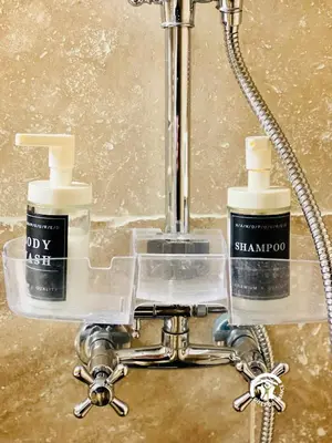 two bottles ofodorizers sitting on a holder in a bathroom at Loft cocon climatisé - Imprenable vue sur le château Comtal in Carcassonne