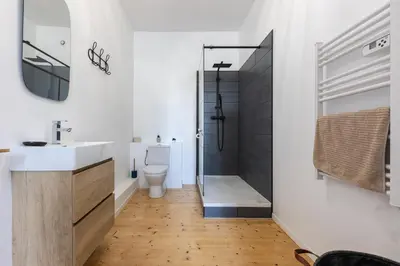 a bathroom with a toilet and a sink and a shower at Maison de Vacances 8 à 15 pers à proximité du Canal du Midi in Sallèles-dʼAude