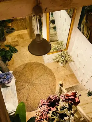 an overhead view of a room with a table and an umbrella at Hôte Labyrinthe sur la place chambres d, hôtes , calme ,Netflix in Mirepoix