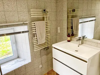 a bathroom with a sink and a mirror at Maison CABARET Luxury 4 Star Air Conditioned 100m to 4 Cathar Châteaux Lastours private Terrasse with views!! in Lastours