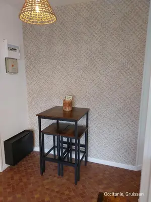 a small table in a room with a lamp at Studio avec accès direct sur le port de Gruissan in Gruissan