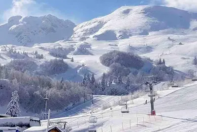 a snow covered mountain with a ski lift at Maison 6 places, en plein cœur de l’Ariège, proche ski et nature in Lesparrou