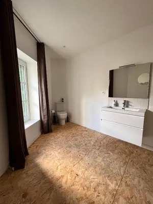 a bathroom with a sink and a toilet at Au pied de la Cité in Carcassonne