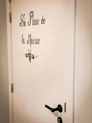 a white door with the words let peace be be nature at Vins de Dagne in Montlaur