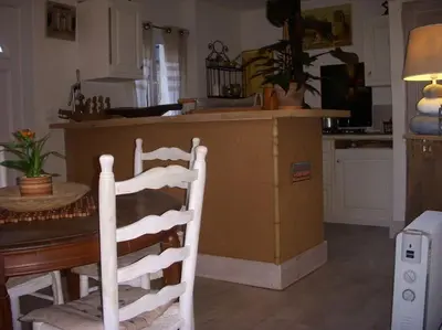 a bedroom with a large bed in a log cabin at Un havre de paix in Aigues-Vives