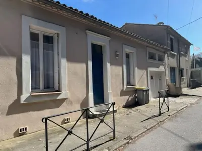 a house with a sign in front of it at Maison la Soleiade in Carcassonne