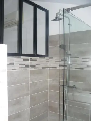 a bathroom with a shower with a glass door at Casa Vignes & Soleil in Puisserguier