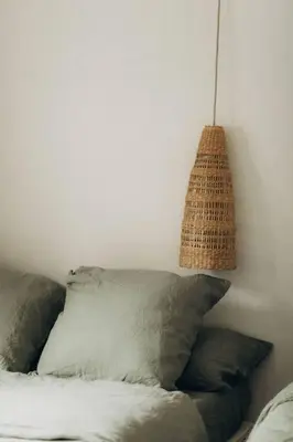 a room with a couch with a hanging lamp at Gîtes Chaleureux écoresponsable in Montesquieu-Lauragais